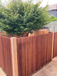 Hardwood batten screen installed as backyard fence